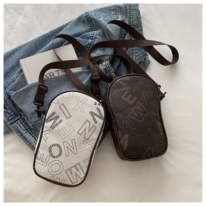Close-up of stylish mini crossbody bags with vintage letter prints and adjustable straps