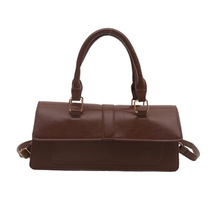 Retro dark brown crinkled patent leather shoulder bag with gold hardware and top handle
