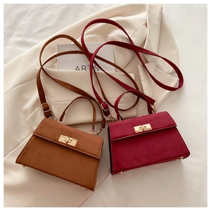 Retro trapezoid handbags in brown and wine red suede with elegant gold twist lock detail