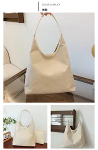 Detail view of large off-white hobo tote bag and matching small zipper pouch set
