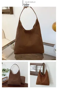 Detail view of coffee brown suede tote bag with matching pouch in a lifestyle setting