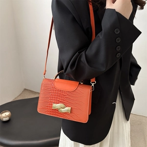 Fashionable orange crocodile pattern leather crossbody bag with gold wave buckle for women