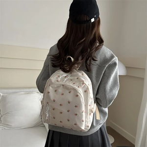 Floral print casual beige backpack for women showing natural outdoor style on a back view