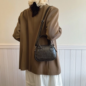 Deep brown retro bowling handbag for women with embossed letters and crossbody strap