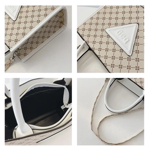 Detail view of large capacity cream tote bag with floral print and adjustable strap