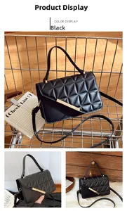 Détail du sac matelassé noir avec boucle dorée et poignée supérieure élégante
