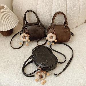 Retro large bowling handbags in black, dark brown, and tan with cute plush charms
