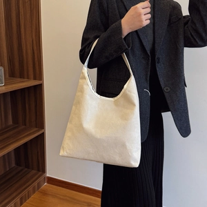 Minimalist cream shoulder tote bag for women showing its large capacity and sleek design