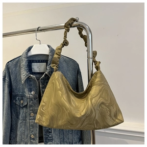 Detail of hobo bag featuring marble silk texture and elegant gathered cloud handle