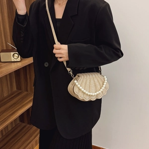 Elegant gold shell crossbody bag with sequins, pearl handle and metal chain strap