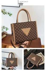 Detailed close-up of coffee brown tote bag with geometric texture and leather strap