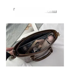 Detailed view of spacious interior with striped lining and organized daily essentials