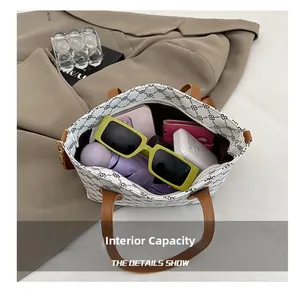 Interior view showing large capacity for essentials in retro floral tote handbag