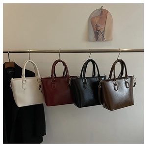 Selection of retro large capacity bucket bags in beige, burgundy, black, and brown