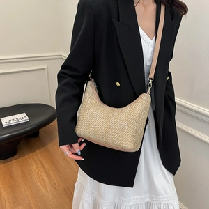 Fashionable woven straw crescent shoulder bag with beige leather strap for women