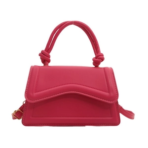 Magenta PU leather handbag with trapezoid body, wavy flap, and knotted handle detail