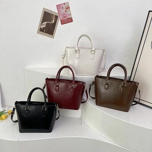 Minimalist faux leather tote bag in four colors with adjustable shoulder straps