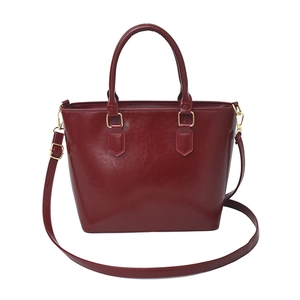 Retro wine red glossy bucket bag with golden hardware and adjustable strap