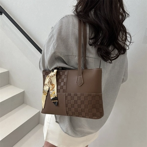 Brown patchwork tote bag with decorative silk scarf on handle, stylish office commute bag