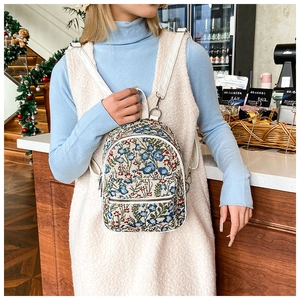Floral mini backpack for women in jacquard fabric with white leather straps and accents