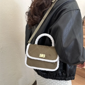 Olive green quilted handbag with white plush fur trim and golden twist lock closure