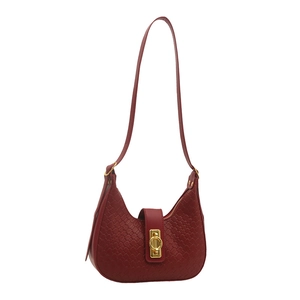 Deep red woven leather hobo bag with gold twist lock and crescent shape design