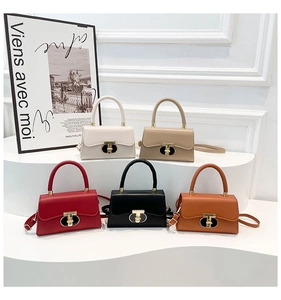 Chic handbags in five colors featuring golden oval T-buckles and elegant top handles