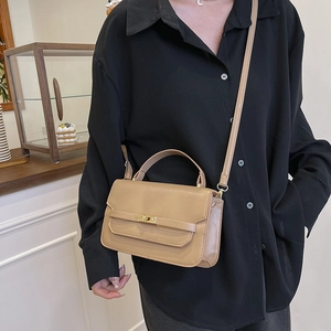Minimalist khaki leather handbag with golden twist lock and top handle for women