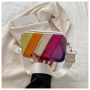 Detail of colorful metallic striped square bag with white woven strap and gold buckle