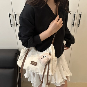 Fashionable creamy white large capacity tote bag with brown straps and cute bear charm
