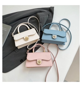 Three mini leather handbags in cream white, light blue and pink with gold locks