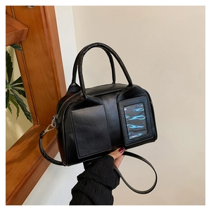 Detail of black matte Boston bag with dual square pockets and a clear card window