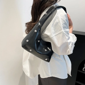 Minimalist black rivet shoulder bag with glossy PU leather finish and silver metal studs