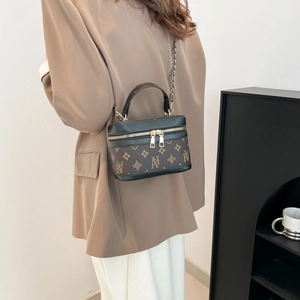 Classic monogram chain handbag with brown floral canvas and black leather trim for women