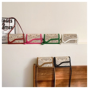 Detail of vintage style crossbody bags with jacquard floral patterns in six assorted colors