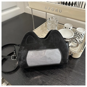 Close-up of cat-ear design shoulder bag with grey woven texture and black suede finish