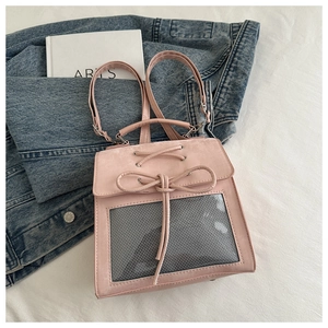 Detailed view of pink ita-bag with adjustable bow tie and clear display window