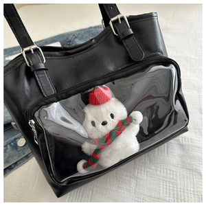 Detail of black PU leather tote with transparent PVC window for plush doll display