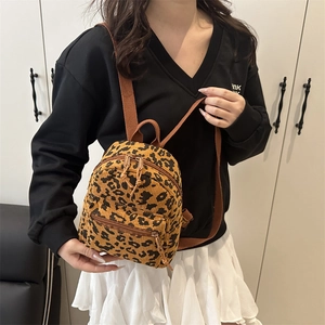 Mini corduroy leopard print backpack with adjustable straps and front pocket detail