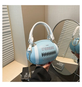 Detailed view of rugby-shaped light blue bag with SDIYABOLO logo and gold chain