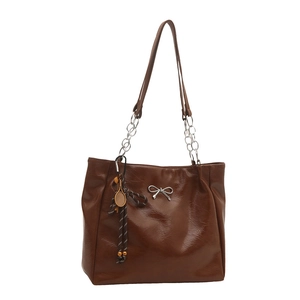 Retro brown oversized tote bag with shiny oil wax leather and silver bow pendant charm