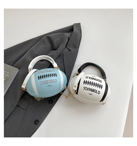 Detail of rugby-shaped handbags in light blue and white with pebbled texture