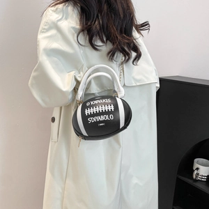 Black football-shaped leather handbag with white stripes and elegant gold chain strap