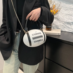 Unique rugby shaped crossbody bag in black and white with gold chain strap for women