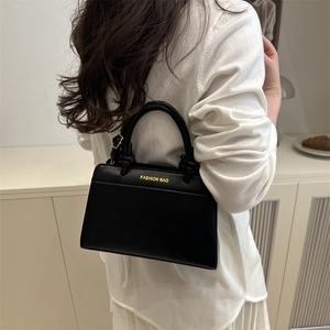 2025 Large black faux leather trapezoid tote bag with gold FASHION BAG lettering