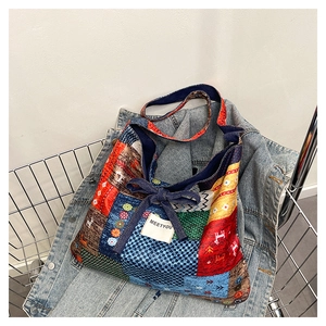 Close-up of patchwork fabric tote bag with floral patterns, bow detail and Meetyou label