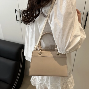 Large capacity beige shoulder bag for women with leather handle and adjustable strap