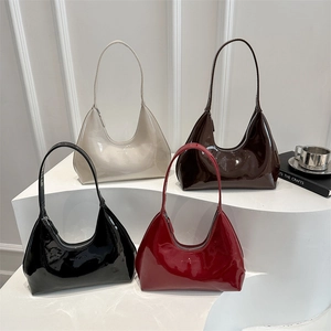 Glossy patent leather crescent shoulder bags in black, beige, brown, and red colors