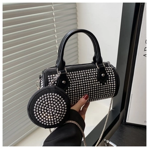 Detail of black cylinder bag with silver rhinestones, chain strap and matching coin purse