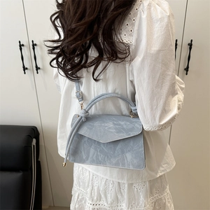 Retro light blue trapezoid handbag with knotted handle and adjustable shoulder strap